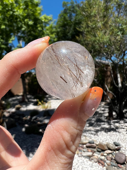 Quartz Spheres with Rutile: A Marriage of Energies and Insights
