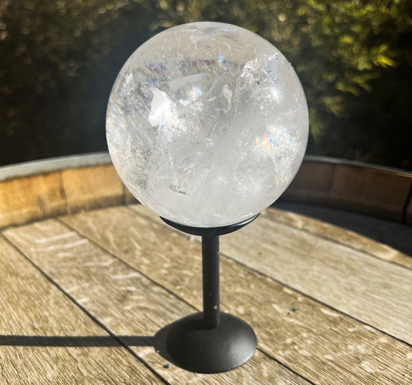 Image of a quartz sphere on a stand. 